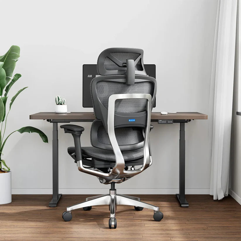 Rear view of a black OdinLake O1 ergonomic chair showing the center gas lift above the five-star base