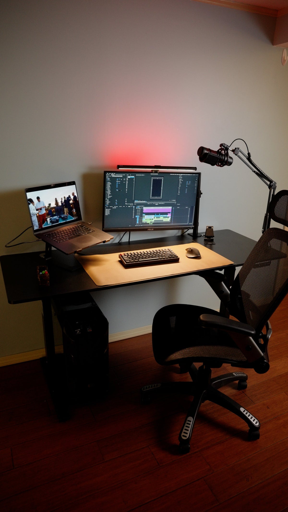 OdinLake S2 standing desk with monitor, laptop, chair, PC tower, and surrounding floor space
