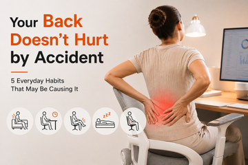 Person experiencing lower back pain from poor sitting habits at a desk