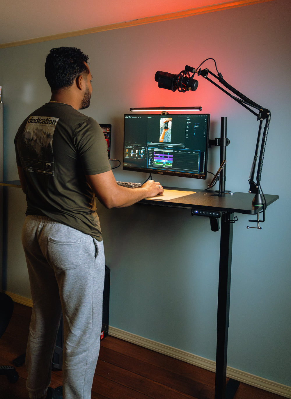 Person working while standing at an OdinLake S2 height-adjustable desk