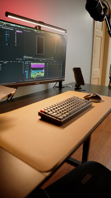 OdinLake computer desk with a monitor, keyboard, and mouse arranged across the desktop depth